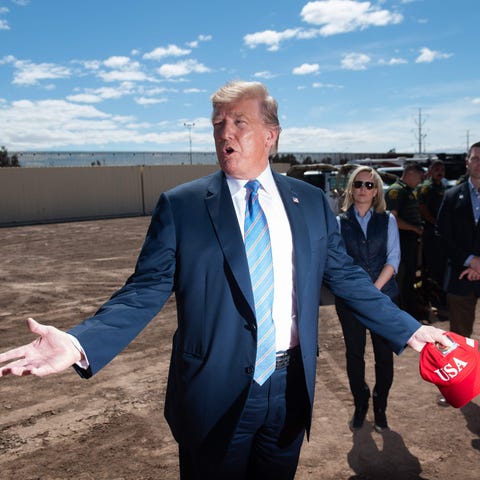 President Donald Trump tours the border wall...