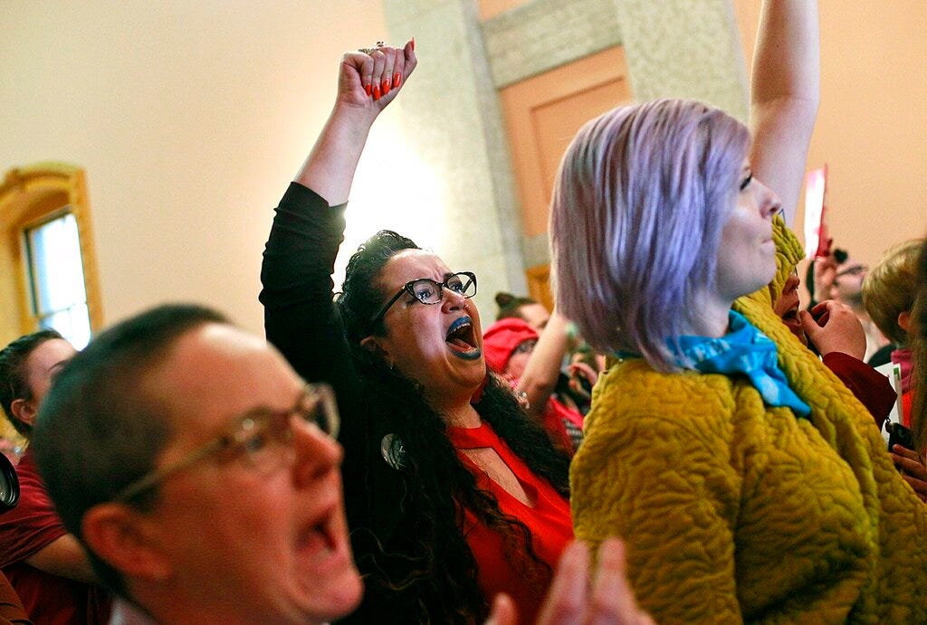 Kimberly Inez McGuire shouts "Shame" while members of the Ohio House of Representatives exit their meeting at the Ohio Statehouse in Columbus, Ohio on Wednesday, April 10, 2019. The House members voted in the controversial "Heartbeat Bill" that bans abortion at the first sounds of a fetal heartbeat, which is around 6 weeks after conception. Many protestors shouted in the hallway outside of the meeting where House members decided to pass the bill. (Brooke LaValley/The Columbus Dispatch via AP)