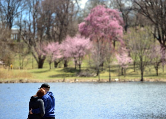 Vanessa Arias of Ridgefield Park and Michael Principe of Bayonne take in the sunny spring day in Branch Brook Park, Newark on Wednesday April 10, 2019.