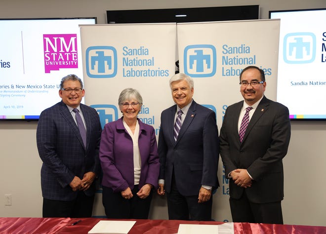 New Mexico State University and Sandia National Laboratories signed a 10-year memorandum of understanding April 10 in Albuquerque. From left, Jaime Moya, director of environment, safety and health, Sandia National Laboratories; Susan Seestrom, associate labs director and chief research officer, Sandia National Laboratories; Dan Arvizu, NMSU chancellor; and Dan Sanchez, technology partnerships program manager, National Nuclear Security Administration Sandia Field Office; attend the signing ceremony.