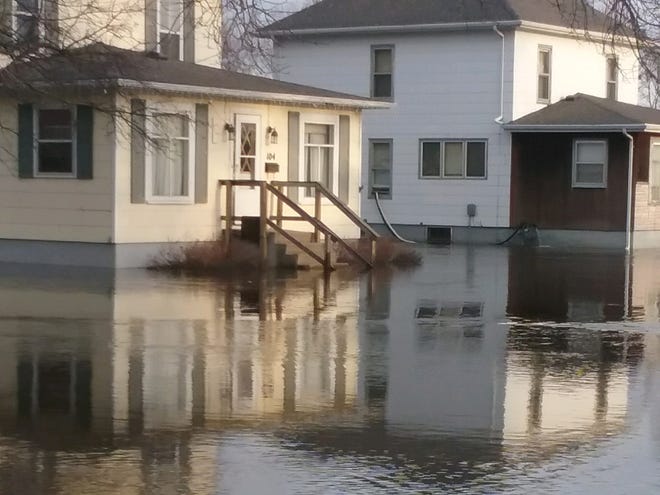 The home of Kelly and Megan Tiernan is swallowed up by the Big Sioux River in Dell Rapids.