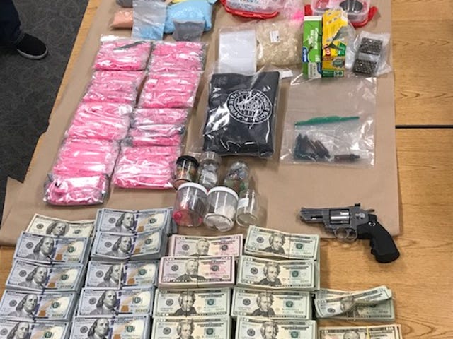 Ecstasy, cocaine, MDMA, LSD, sales paraphernalia and cash seized by Simi Valley police during a drug-related search warrant on Wednesday.