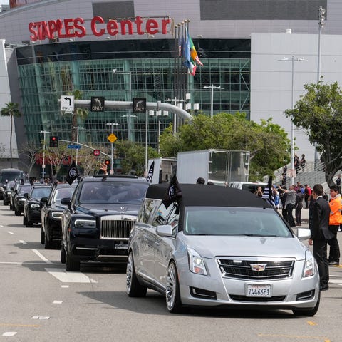The hearse carrying Nipsey Hussle leaves the...