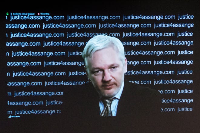 Julian Assange addresses a press conference at the Frontline Club via video link from the Ecuadorian embassy in 2016.