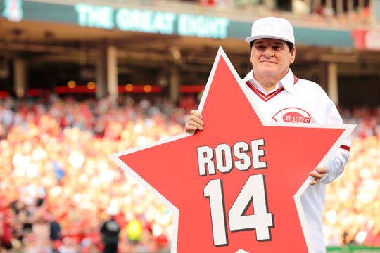 Reds great Pete Rose holds a star bearing his name before a Reds-Padres game at GABP in June of 2016.