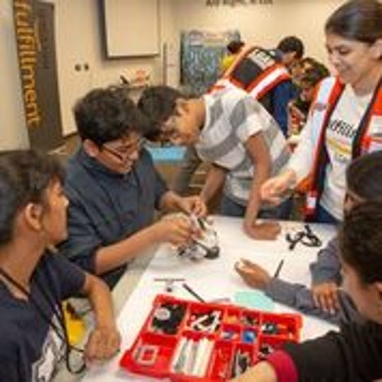 Amazon celebrates National Robotics Week with local middle schools at Edison fulfillment center
