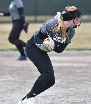 Seaholm shortstop Reagan Hurd scoops up a Marian hit and prepares to fire to first base on April 11, 2019.