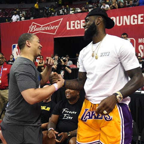 Tyronn Lue greets LeBron James after a Summer...