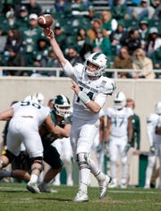 Quarterback Brian Lewerke of Michigan State pitched a pass during a spring game in East Lansing.