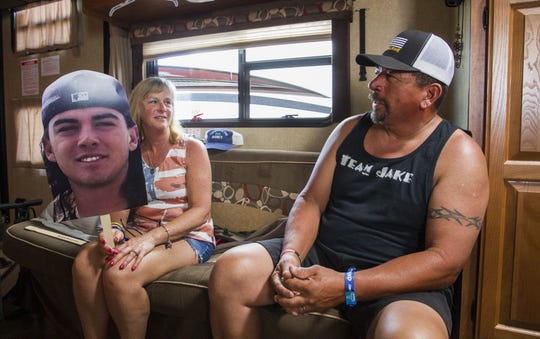 Terri Morales holds a photo of her son, Jake, as she and her husband, Ray, of Prescott Valley, talk about the unexpected death of their son who loved Country Thunder Arizona on Saturday, April 13, 2019, in Florence, Ariz. The Morales were at Country Thunder to honor Jake and his friend Gunner Bundrick.