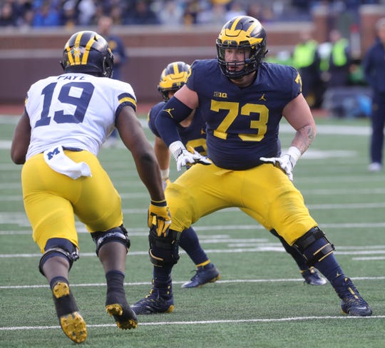 Michigan offensive lineman Jalen Mayfield blocks defensive end Kwity Paye during the spring game Saturday, April 13, 2019 at Michigan Stadium in Ann Arbor.