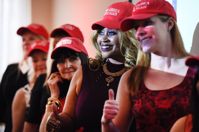 Republican women for President Trump, wearing Make America Great Again hats,   give a thumbs up during the Style Show at the Trumperware event in Flushing.