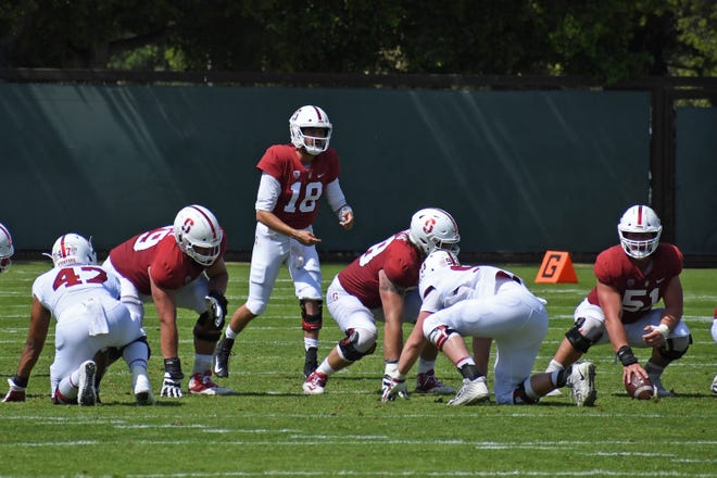 Palma graduates Jack Richardson (18) and Drew Dalman (51) took to the field Saturday for the Cardinal's annual spring game.