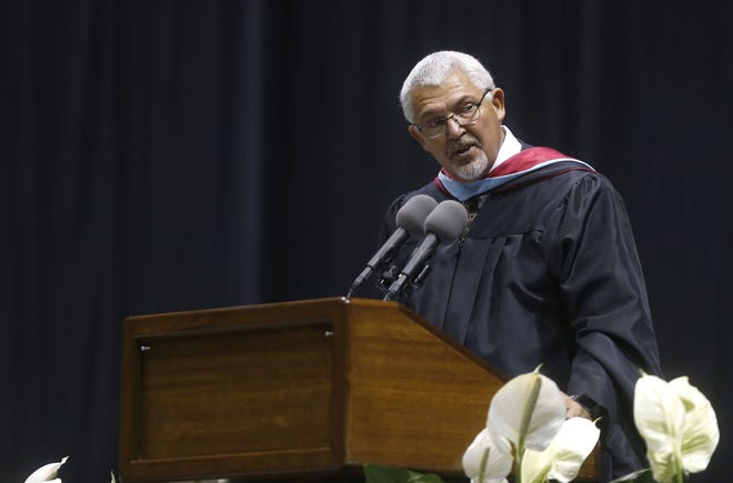 Hillcrest High School principal Garry Moore, speaking at the 2017 graduation at JQH Arena, will step down June 30. His future plans have not yet been announced.