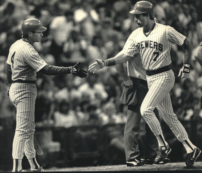 Milwaukee's Dale Sveum (right) received a handshake from Paul Molitor after hitting his first of three homers against the California Angels in 1987.