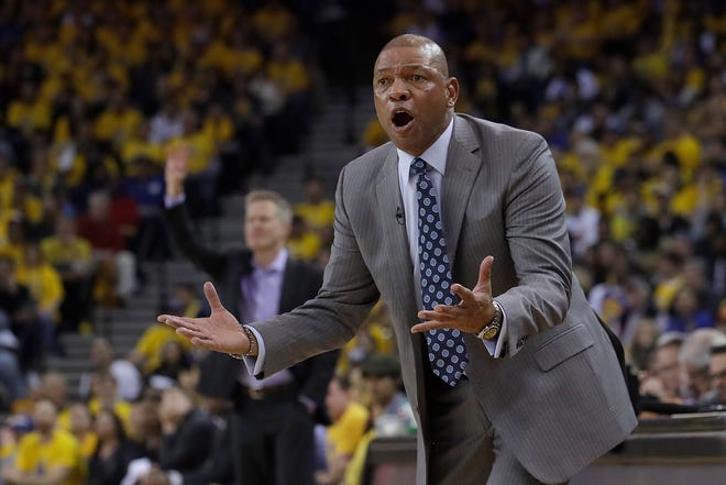 Los Angeles Clippers head coach Doc Rivers gestures toward an official during the first half of Game 2 of a first-round NBA basketball playoff series against the Golden State Warriors in Oakland, Calif., Monday, April 15, 2019.
