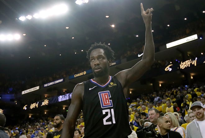 Los Angeles Clippers guard Patrick Beverley celebrates during the second half of Game 2 of a first-round NBA basketball playoff series against the Golden State Warriors in Oakland, Calif., Monday, April 15, 2019.
