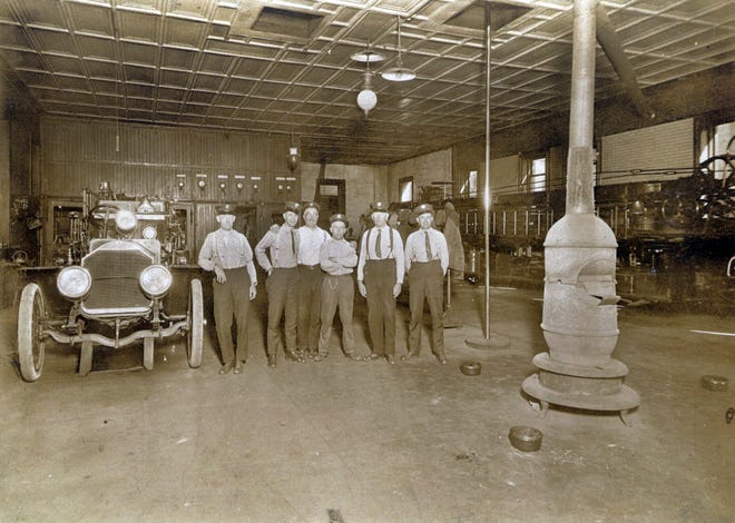 This photo shows a turn at the old Central Station on Sixth Street. While this  photo is probably from the 1920s or 1930s, notice that four of the six firefighters are wearing ties.