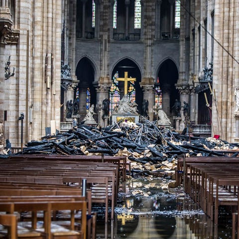Debris is seen inside of Notre Dame Cathedral on...