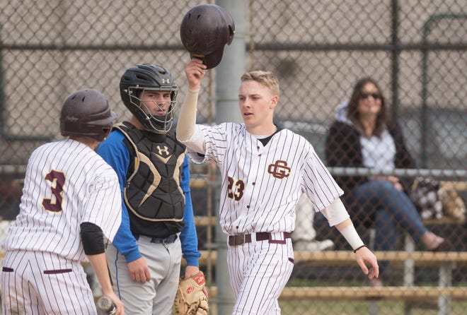 Gloucester Catholic’s Tyler Cannon, right, celebrates after scoring a run during Gloucester Catholic’s 13- 0 win over Pennsville at Joe Barth Field in Brooklawn on Wednesday, April 17, 2019.  