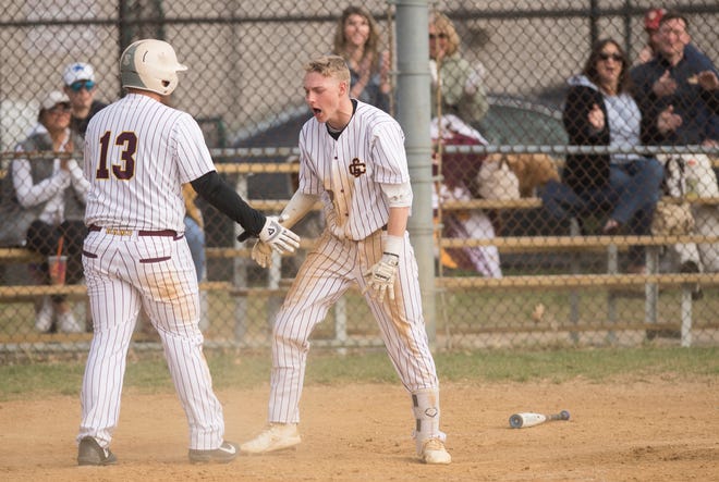 Gloucester Catholic's Tyler Cannon, right, celebrates with Gloucester Catholic's Lillo Paxia after Cannon hit an inside-the-park, 3-run home run during the  bottom of the fourth inning of Gloucester Catholic's 13- 0 win over Pennsville at Joe Barth Field in Brooklawn on Wednesday, April 17, 2019.