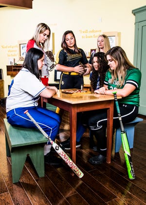 Area softball teams look to make history as the first half of the season rounds the corner. From left to right are Southeastern’s Stacia Francis, Piketon’s Abby Carter, Paint Valley’s Savannah Smith, Waverly’s Hannah Robinson, Chillicothe’s Alysia Cunningham, and Huntington’s Brodey Entler. Photo taken inside the children’s room at the Adena Mansion and Garden’s Historical Site museum.