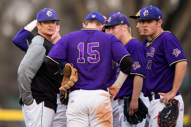 The infielders on Fort Collins High School's baseball team gathers on the mound with coach Marc Wagner during an April 16, 2019, game against Rocky Mountain at City Park. The Lambkins will play another cross-town rival at 4 p.m. Tuesday, when they host Poudre.