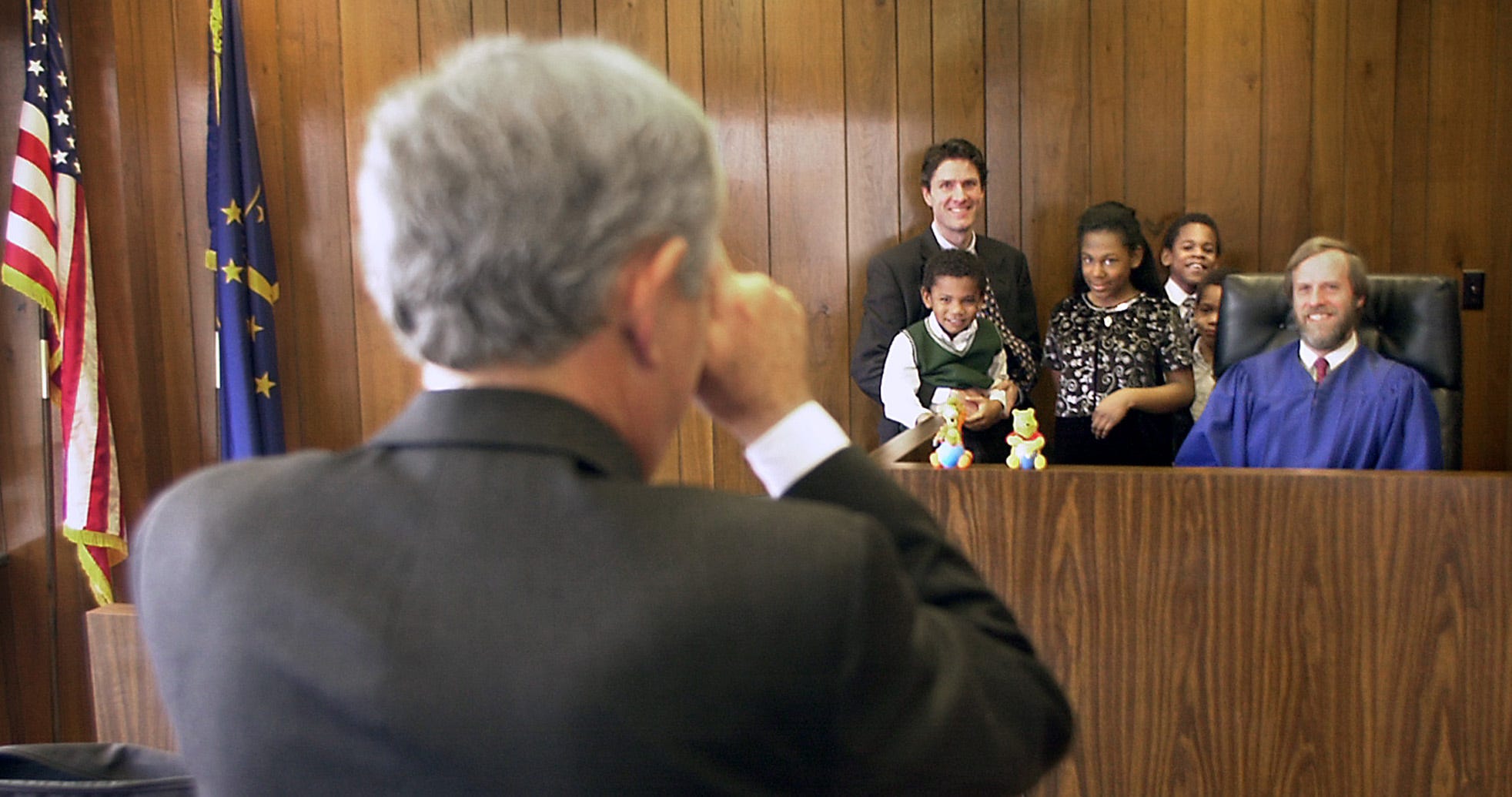 Craig Peterson and his sons, Brandon, Andrew and Michael are photographed with Ashley after her adoption was approved in 2001.