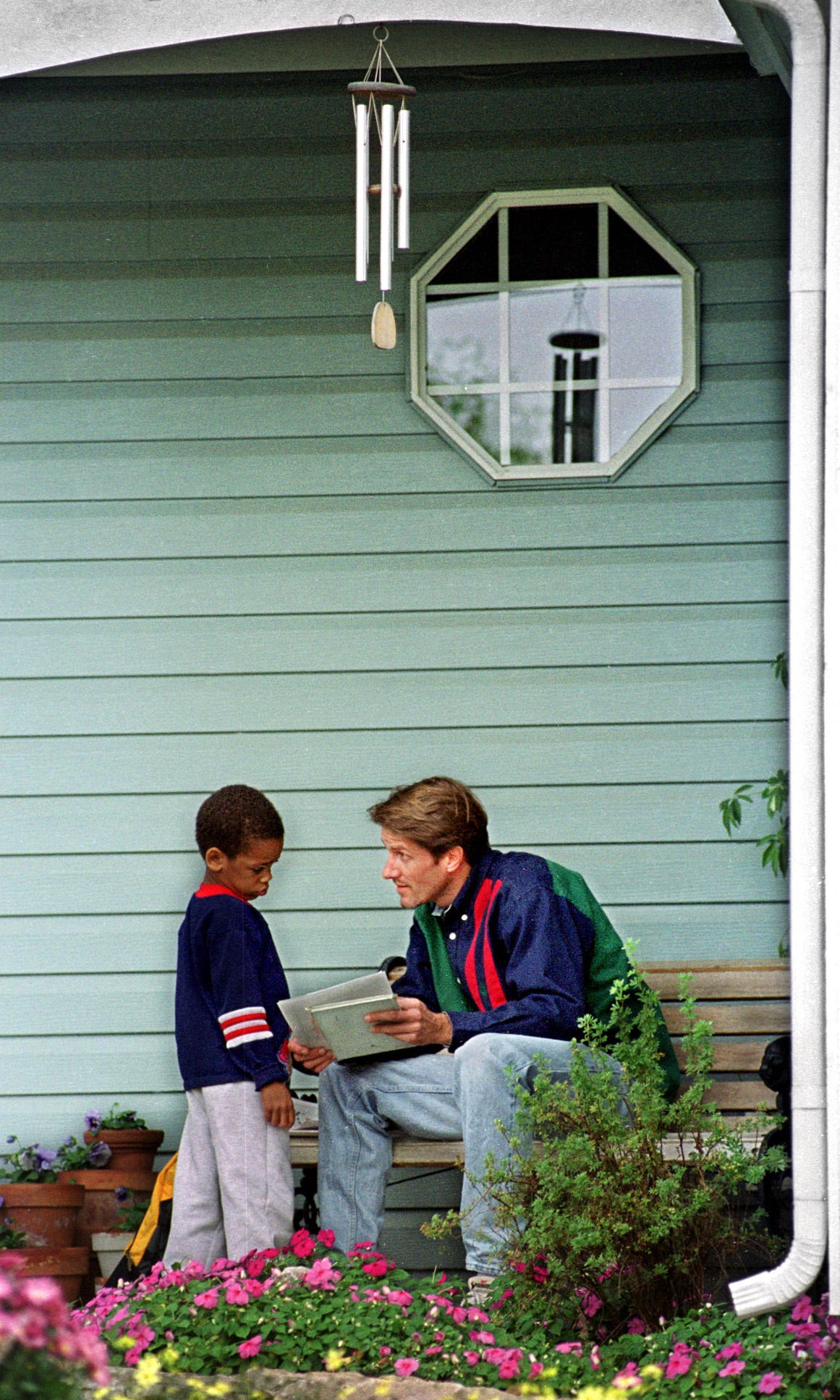 Craig Peterson had his son, Michael, share his homework with him before entering the house. Peterson, then 39, believes structure is key for his three sons due to their fetal alcohol syndrome diagnoses.