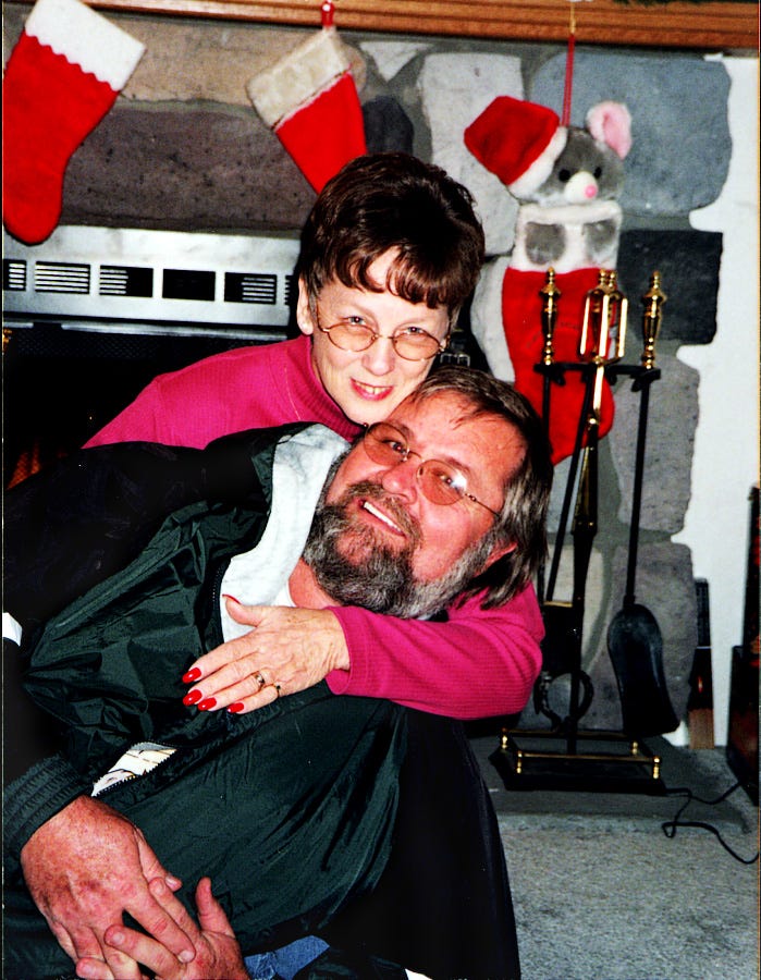 Earl "Butch" Kimmerling and his wife, Sandy hug for a picture from Christmas 1998.