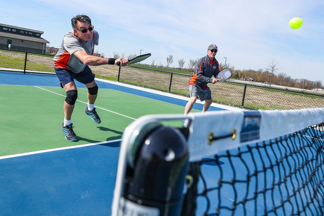 plays a game of pickleball at Cyntheanne Park in Fishers, Ind., Tuesday, April 16, 2019. Fishers resident Steve Cage recently donated $63,000 to Fishers Parks & Recreation and the Fishers Parks Foundation for the addition of two new "challenge" courts, geared toward intermediate and advanced players.