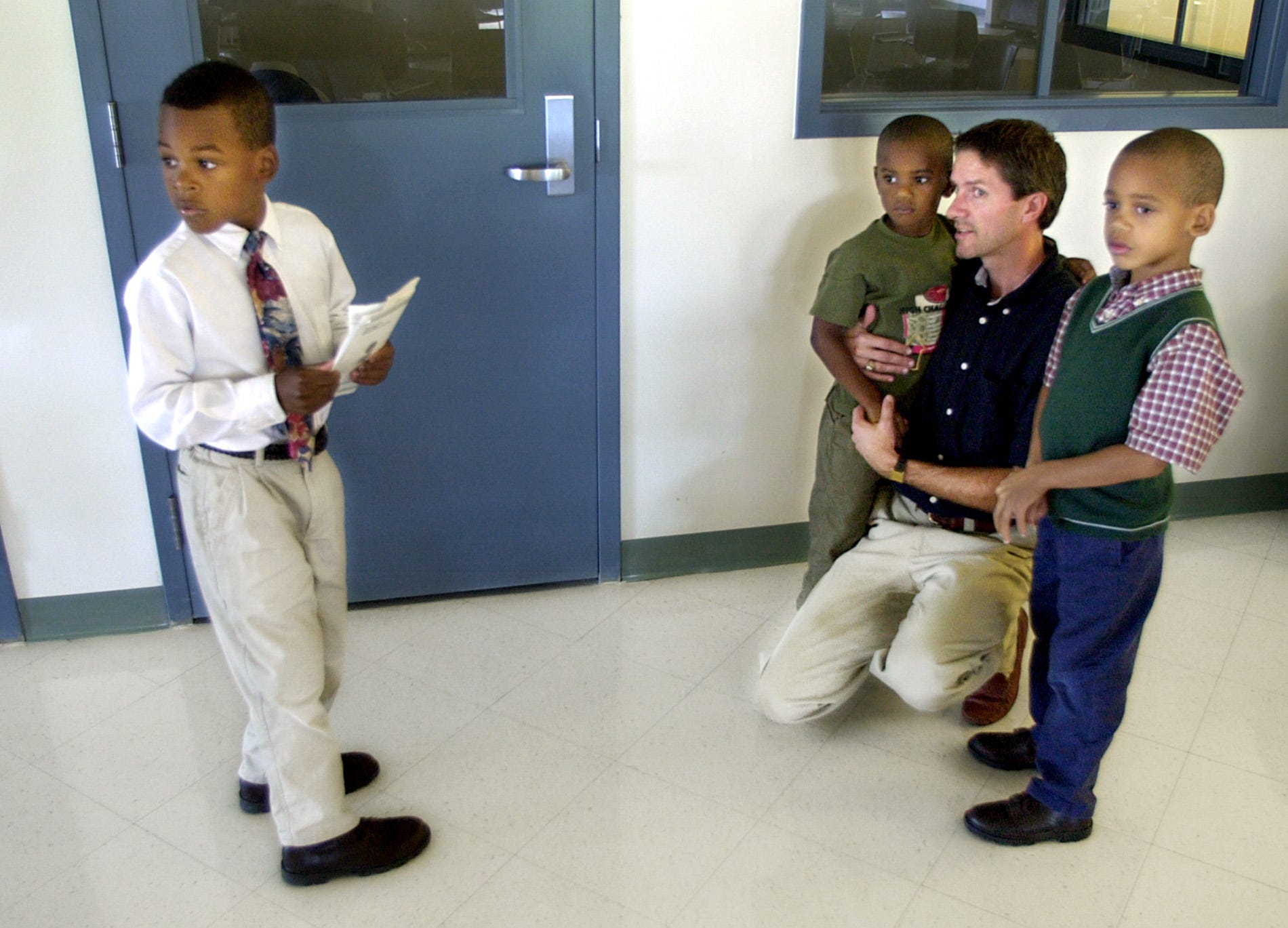 Craig Peterson and his three sons, Brandon, Michael and Andrew, visit their biological mother Kim Guiden in the Rockville Correctional Facility in Rockville, Indiana.