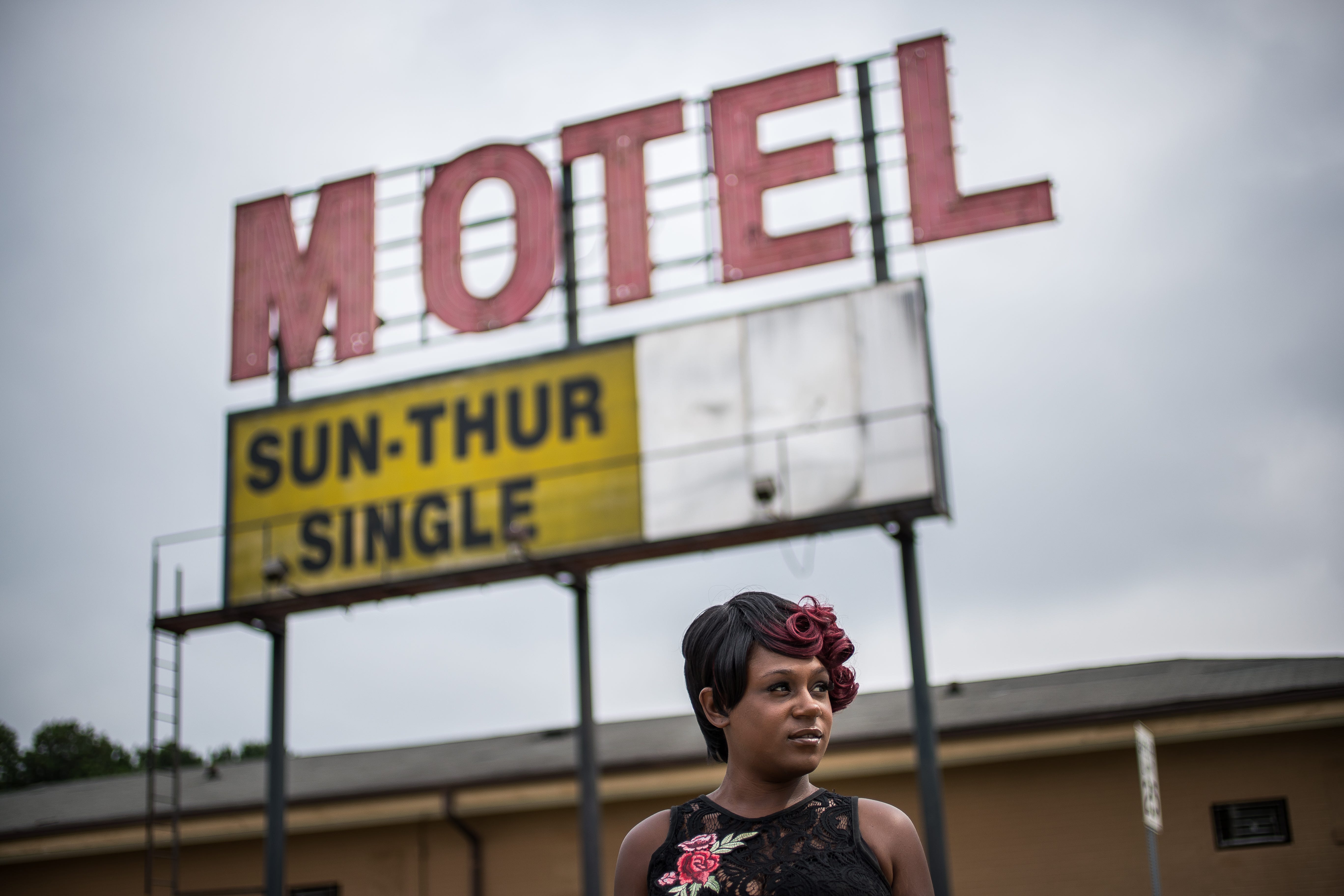 Ashley Peterson poses for a portrait in front of the Airway Motel in Atlanta.