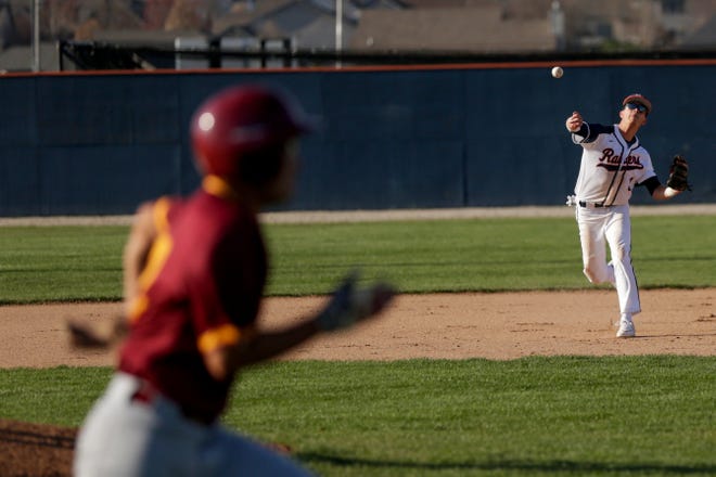 Harrison short stop Trey Cochran (3) throws to first to out the runner during the third inning of a high school baseball game, Tuesday, April 16, 2019, at Harrison High School in West Lafayette. McCutcheon won, 8-3.