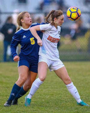Hartland's Maria Storm (5) and Brighton's Abbigail Bowland battle for the ball during the Eagles' 3-1 victory on Tuesday, April 16, 2019.