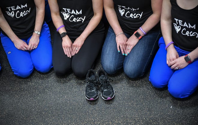 Casey Myers' running shoes are treasured by her friends and co-workers who plan to honor her memory by participating in Earth Day Run activities this weekend.
