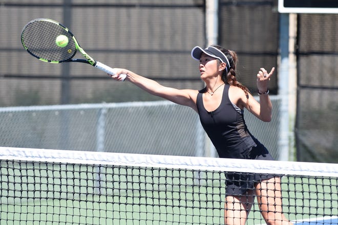 Rider's Julia Chon returns the ball Wednesday during the Region I-5A mixed doubles quarterfinals in Lubbock.