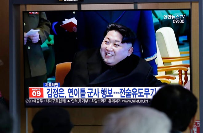 People watch a TV news program reporting North Korea's test-fire of a "new-type tactical guided weapon," with a file footage of North Korean leader Kim Jong Un, at the Seoul Railway Station in Seoul, South Korea, Thursday, April 18, 2019.