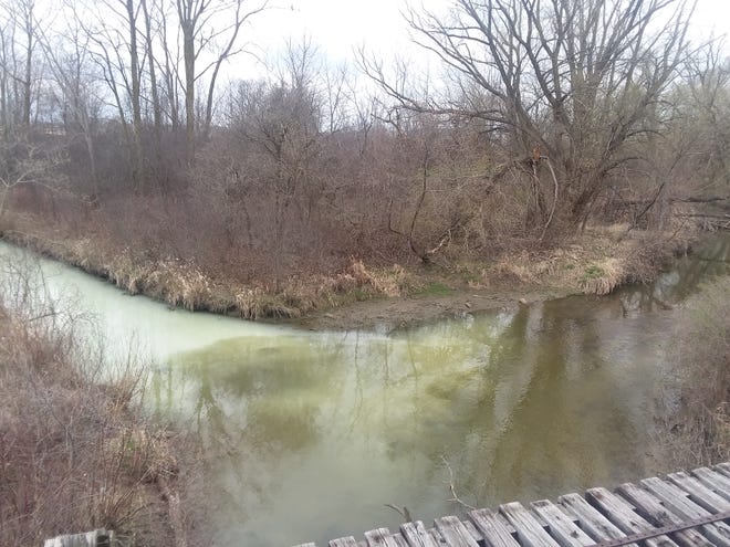 Crews are working to keep the substance found Thursday from traveling downstream.