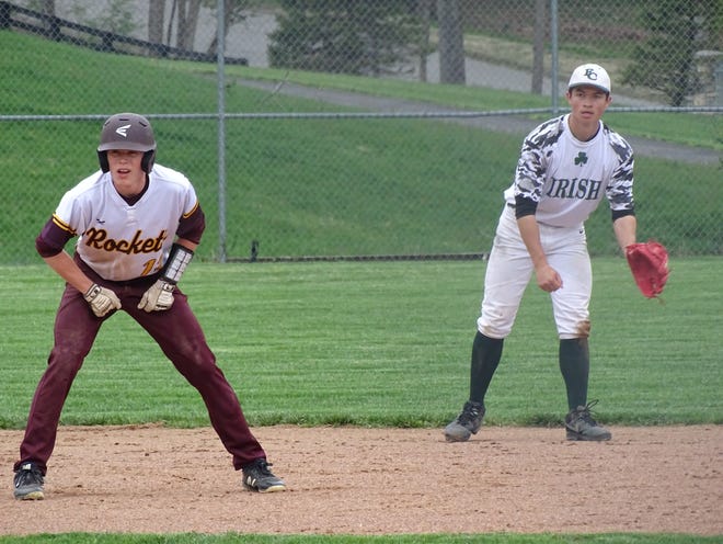 Berne Union's Drew Berstler leads off second base while Fisher Catholic shortstop Dylan Piko tries to keep him close  during Wednesday's Mid-State League-Cardinal Division game. The Irish won 7-6.