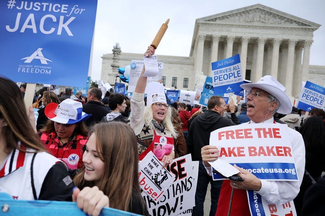 Demonstrators rallied in front of the Supreme Court in December 2017, when the justices heard the case of Masterpiece Cakeshop owner Jack Phillips' refusal to create a cake for a gay couple's wedding celebration.