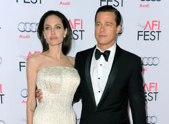 Angelina Jolie, left, and Brad Pitt (in 2015) are now officially single. "Width =" 540 "data-mycapture-src =" "data-mycapture-sm-src ="
