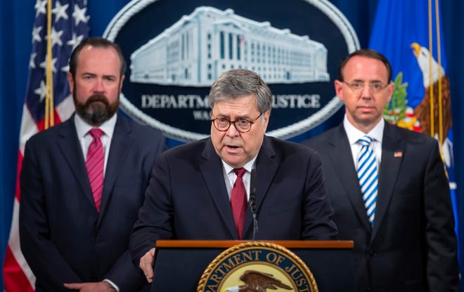 US Attorney General William Barr, center, Acting Principal Associate Deputy Attorney General Ed O'Callaghan, left, and Deputy Attorney General Rod Rosenstein hold a press conference at the US Department of Justice in Washington, DC on April 18, 2019. The briefing comes just before the release of a redacted version of Special Counsel Robert Mueller's report on Russian interference in the 2016 election. 