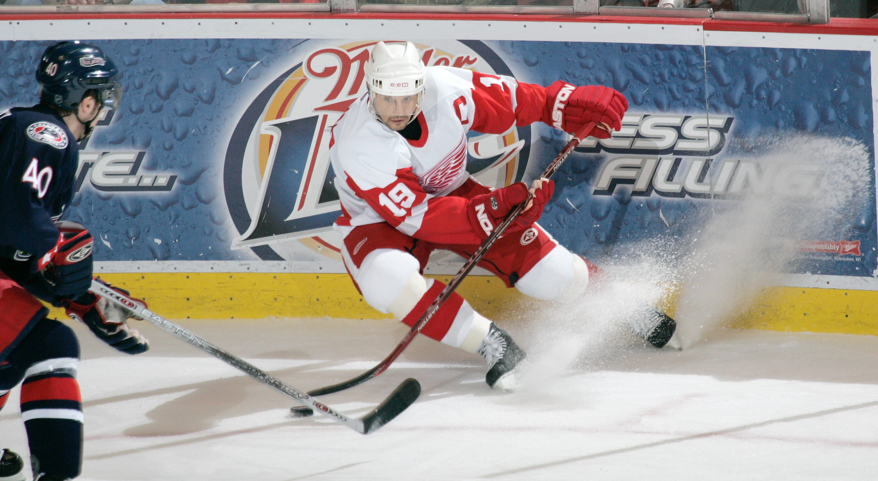 Red Wings captain Steve Yzerman puts on the brakes in front of Blue Jackets Jaroslav Balastik in a 2006 game.