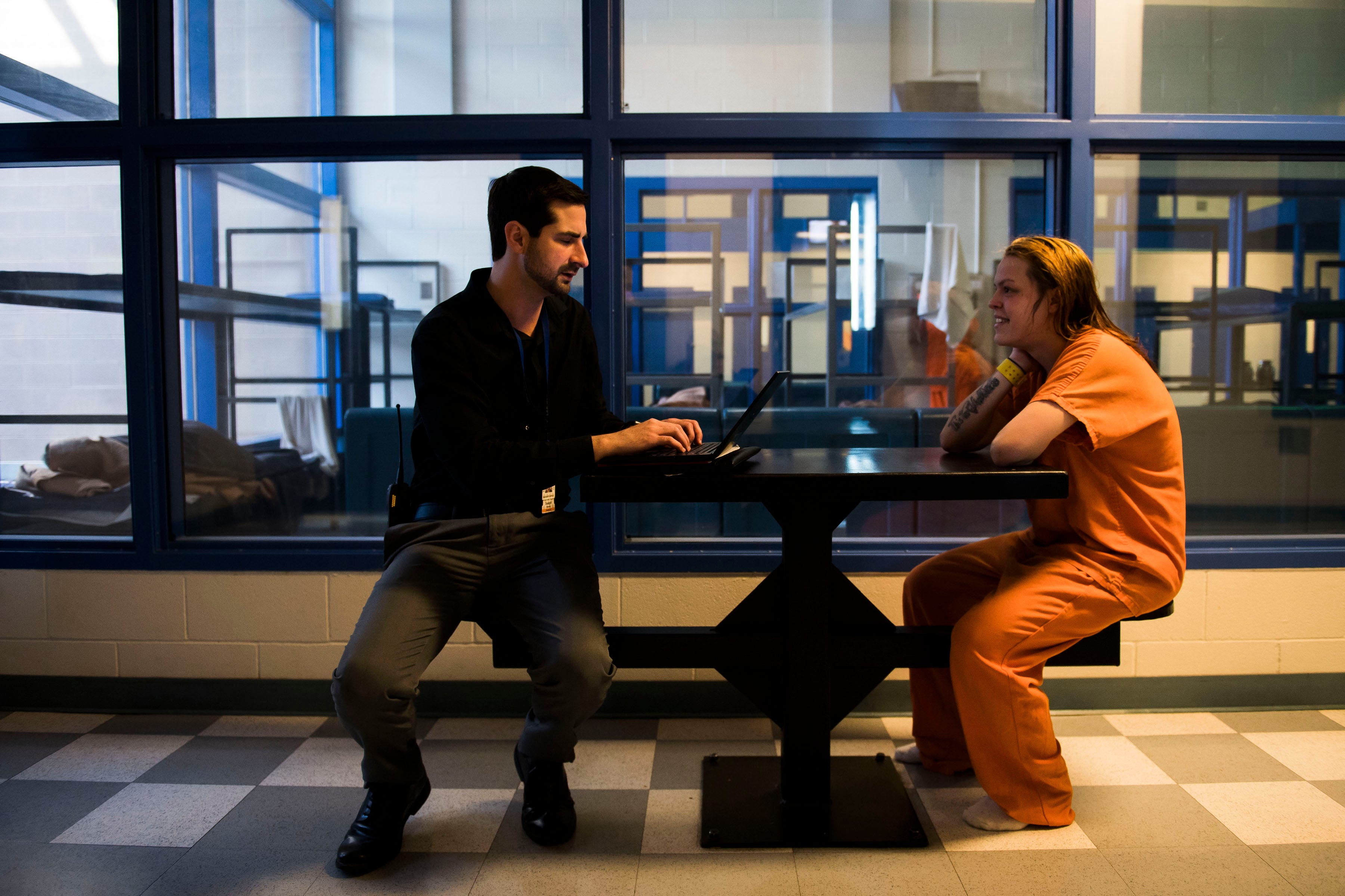 Mental health counselor Joseph Matonte, left, talks with an inmate at the Larimer County Jail on Wednesday, April 3, 2019, in Fort Collins, Colo. 