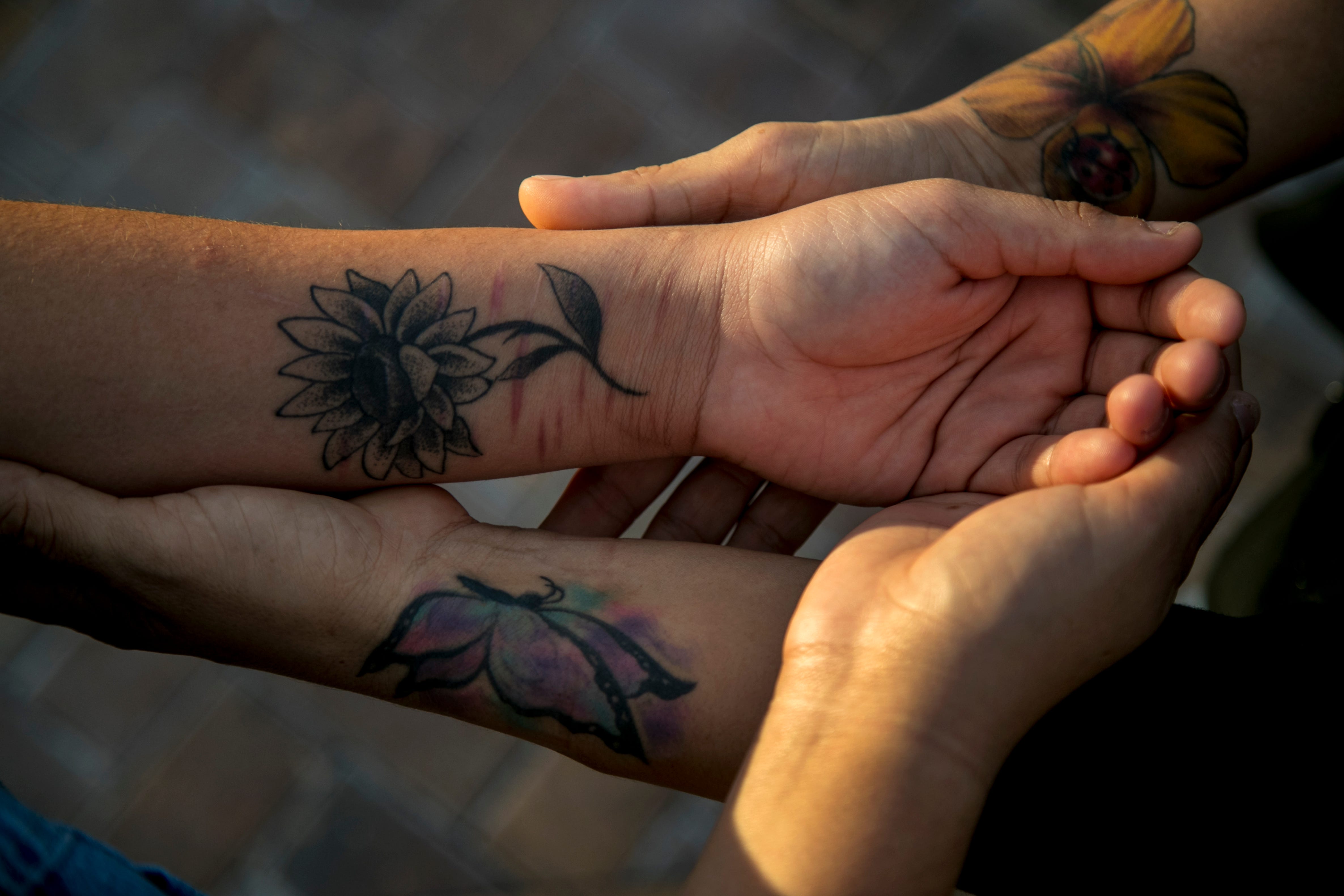 Edith Ortiz's daughter got a sunflower tattoo on her arm in January. "I did it to give people something to stare at," she said.