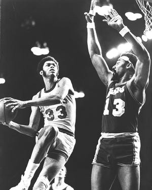 Lew Alcindor drives on Wilt Chamberlain at the Milwaukee Arena.