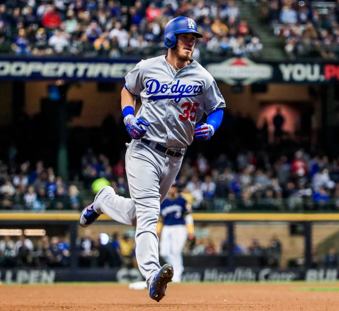 Dodgers right fielder Cody Bellinger rounds the bases after hitting a homer off Matt Albers in the sixth inning.