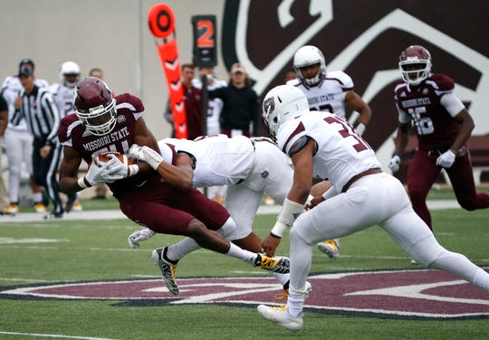 Missouri State football team on the field during a game