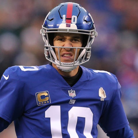 New York Giants quarterback Eli Manning (10)...